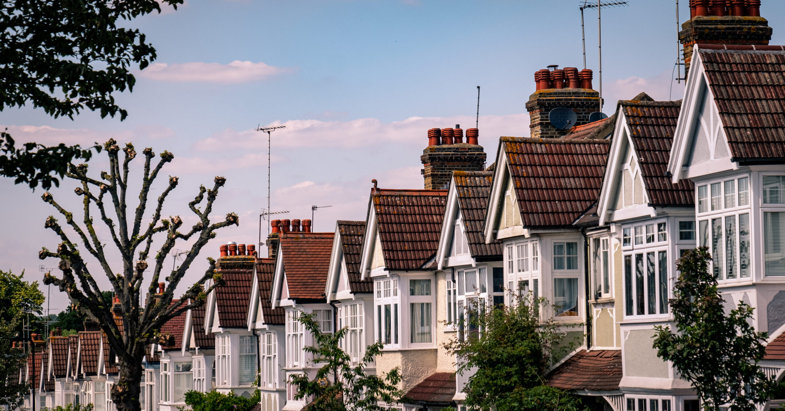 A street of typical British terraced suburban houses