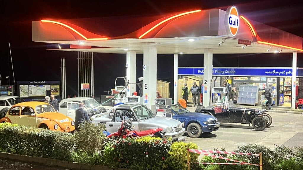 Land's End Trial cars at petrol station