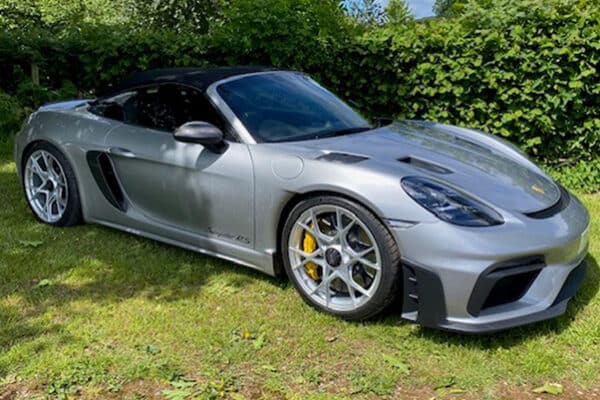 Silver Porsche on grass