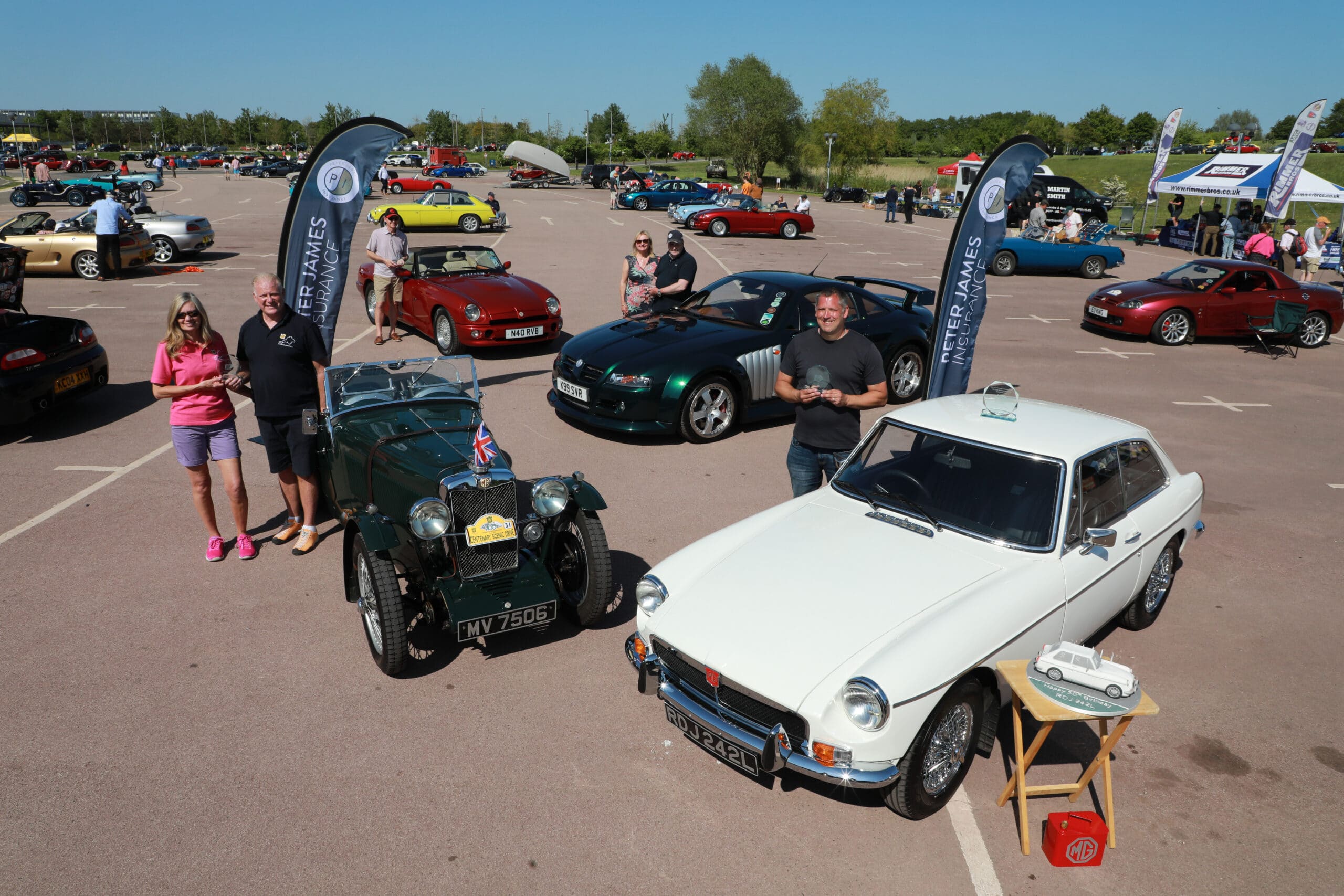 The winners proudly showing their trophies scaled